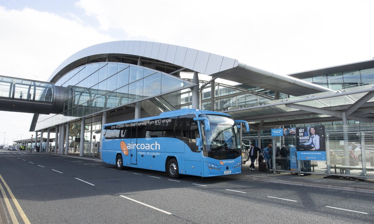 Blue Aircoach Bus Parked at Dublin Airport Terminal 2 Picking Up Passenger