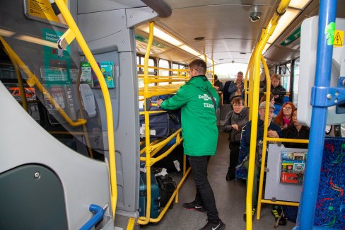 Airlink Sales Promoter can help with your luggage internal image of airlink bus with staff member helping load bags
