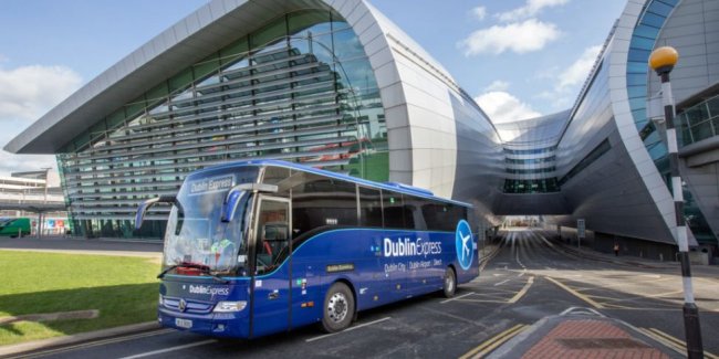 Dublin Express Blue Coach with Terminal 2 in background
